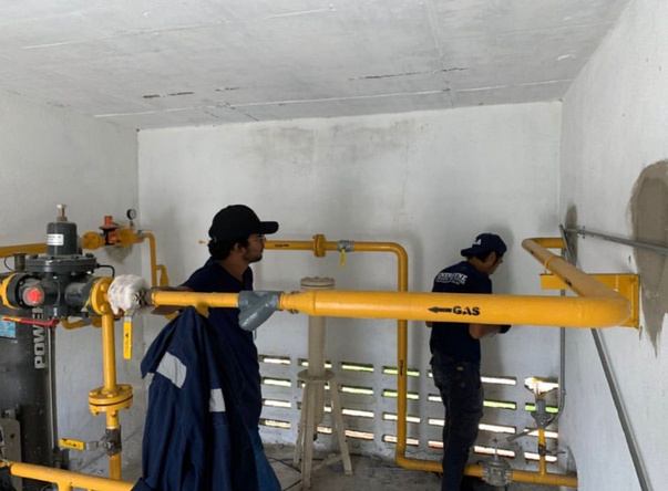 Technicians installing LPG piping
