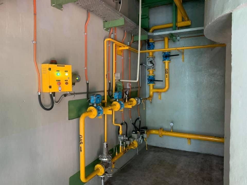 Gas piping and regulators on a wall